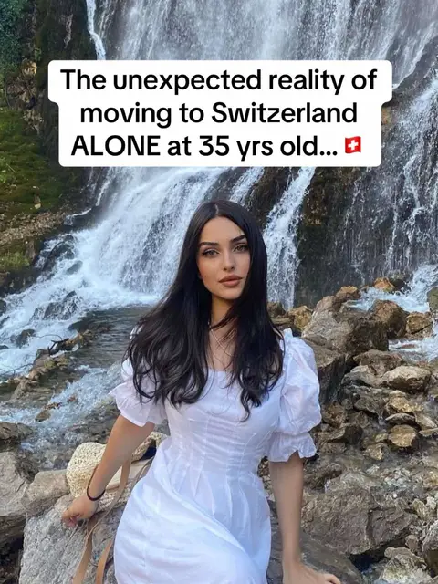 A young woman with long dark hair stands in front of a waterfall. She's wearing a white dress with puff sleeves. Overhead, a white rectangle contains the hook text.