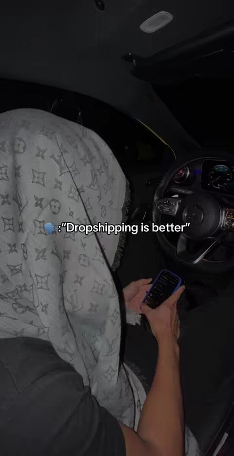 The cover image shows a person in the driver's seat of a car, their face obscured by a patterned scarf. The car interior is dark with visible elements like the steering wheel and part of the dashboard. The person is holding a phone displaying an app.