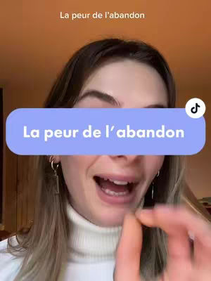 A young woman with long blonde hair is shown from the chest up, with her mouth open as if speaking. A blue rounded rectangle covers the lower half of her face, with white text that reads 'La peur de l'abandon'. The background is a plain orange.