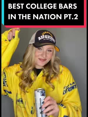 A woman wearing a yellow jacket and a baseball cap is holding a can of a beverage looking at the camera. Above her is a bar that has the text, \"BEST COLLEGE BARS IN THE NATION PT.2\".