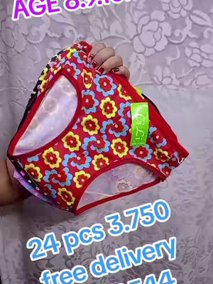 The image displays a hand holding up a pair of red and patterned underwear with a floral motif. Text overlays provide details about the product.
