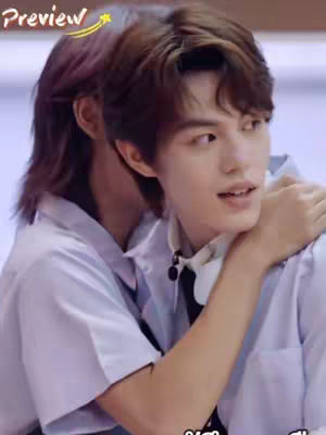 Two young men embrace, looking toward the side with concern, while a text overlay highlights their moment and the video's context.
