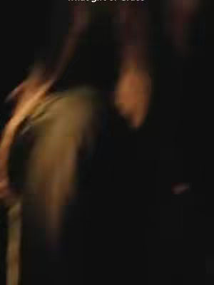 The cover image is dark and blurry, with indistinct figures or shapes. The overall impression is one of low visibility, potentially suggesting a nighttime scene or an indoor setting with minimal lighting.