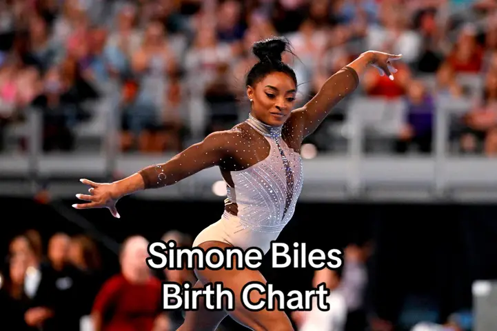 The cover image shows Simone Biles in a dynamic pose during a gymnastics routine. She is mid-air with one arm extended, a focused facial expression, and is wearing a sparkly leotard and sports attire against a blurred background of an arena filled with spectators. The text overlay at the bottom states 'Simone Biles Birth Chart'.