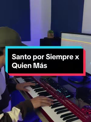 The cover image shows a person in a room with music production equipment. The person is wearing a cap and is seated behind a keyboard. A text overlay in a colored rectangle reads: "Santo por Siempre x Quien Más". The keyboard is red, and a computer screen is in the background. The lighting is artificial, and the color scheme is cool.