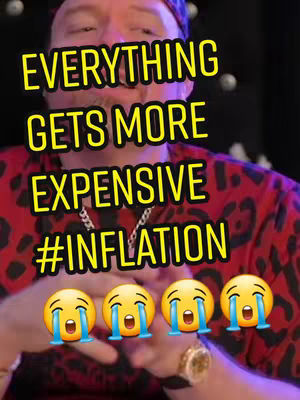The cover image displays a close-up of a man wearing a red and black patterned shirt and a cap. Large, yellow text overlays the image, conveying a message about the economy and inflation, with the hashtag #inflation. Below the text are four yellow, crying face emojis. The background is blurred, with some hints of other elements.