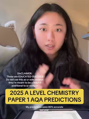 The cover image is a selfie with a light-skinned female in focus. She has long black hair and is wearing a black top. She is in a room, with a light-colored wall and a bit of furniture visible in the background. The image is overlaid with text, including a disclaimer and information about A-Level chemistry predictions.