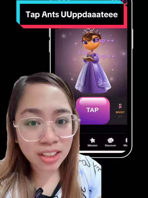 A woman with glasses smiles at the camera. Behind her is a phone showing an app interface with a princess-like character. Text overlays at the top read “Tap Ants UUppddaaateee”.