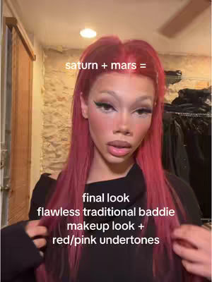 A young woman with long pink hair is the central focus of the image. The background appears to be an interior setting with a wooden door and stone wall. Text overlays, in white, label the content, and specify aspects of the woman's makeup with terms of 'flawless traditional baddie makeup look + red/pink undertones'.