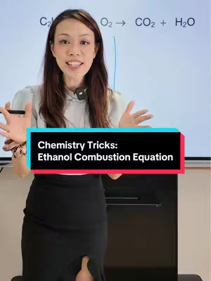 A woman is standing in front of a whiteboard with a chemistry equation written on it. She smiles and gestures with her hands. A text overlay on the bottom highlights the video's topic: Ethanol Combustion Equation.