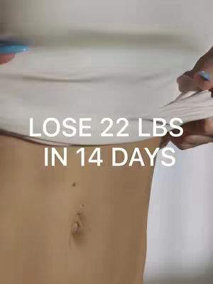 The cover image shows a close-up view of a person's midsection, focusing on their abdomen. The person is wearing a plain white top that is being lifted slightly to reveal the stomach area. The skin appears to be fair-toned. Below the text overlay in white is the abdomen with a few small freckles. The overall composition of the image is simple with the focus on this area.