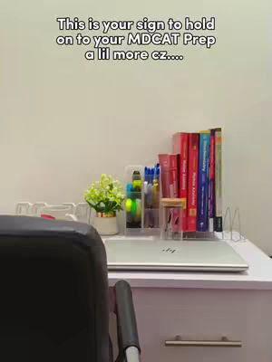 The cover image shows a desk setup with a laptop, books, stationary and a small flower pot. The text 'This is your sign to hold on to your MDCAT Prep a lil more cz....' is overlaid on the image.