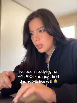 The cover image is a selfie of a young woman, seen from the chest up, looking toward the left with a surprised expression. Her dark hair is styled down. She's wearing a black zipped-up hoodie. Text overlay at the bottom of the screen reads, 'ive been studying for 4 YEARS and I just find this now... like wtf 😭'. The background is blurred, suggesting an indoor setting.