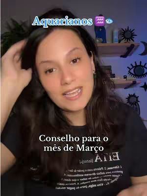 A woman with dark hair is centered in the image, looking towards the viewer with an open mouth as if speaking. Text overlays at the top and bottom, with a shelf visible in the background. The color palette is warm, with a slight blue hue in the background.