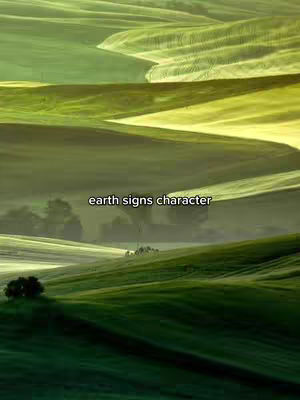 A scenic landscape with rolling green hills, featuring varying shades of green and yellow. The image has a soft, natural lighting, suggesting a peaceful and serene atmosphere.