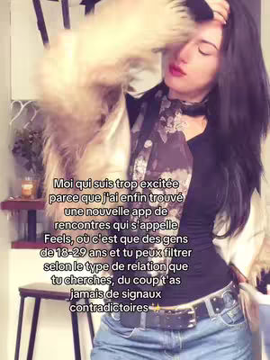A woman in a beige and fur coat with black hair is shown in front of a kitchen standing near a stool with text overlay.