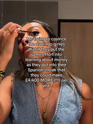 A woman applying mascara while looking up and to the side. Text overlayed on the image.