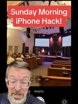 A man with glasses is in the foreground, looking at the camera with a church service in the background, the hook, "Sunday Morning iPhone Hack!" is written on a red rectangle, and the video is taken from the camera app of a phone.