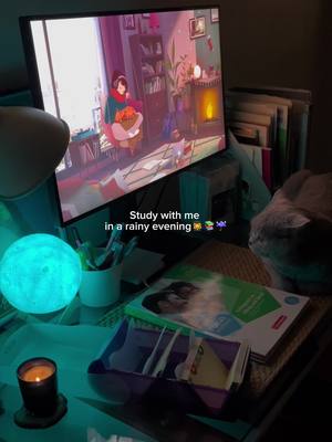 The cover image shows a study setup with a computer monitor displaying an animated scene and study materials. A glowing blue moon-shaped lamp and a lit candle are visible.