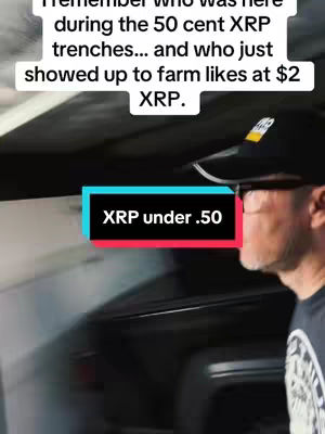A man in a black cap and glasses is seen from the side, facing right. The background is blurred, the man is in a car. Overlay text is added with a label with text, and the background is blurred.