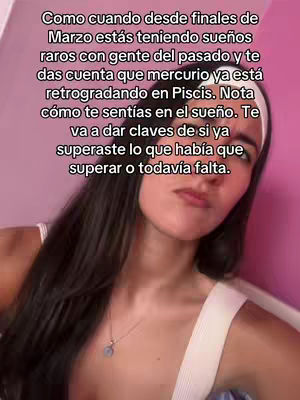 A selfie-style image featuring a young woman from the chest up. She has long, dark hair and is wearing a white top. The background suggests a pink-toned setting. Text in white is overlaid at the top. She is looking up towards the text with a slight look of concern.