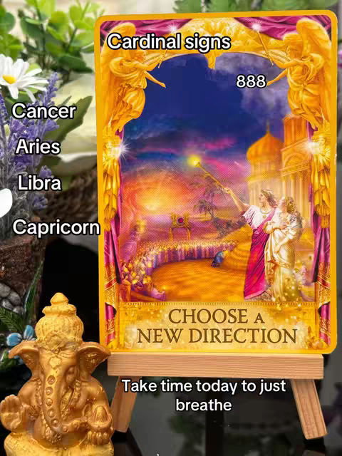 The image is a colorful composition centered around a spiritual theme. The focal point is a framed image featuring an angel-themed artwork. Surrounding the artwork are additional visual elements, including flowers and a small golden statue. There is text written on the picture.