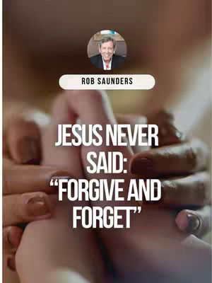 The image features two hands clasped together, with text overlayed. Behind the hands, the background is blurred. At the top, a circular image of a man with a name tag below further identifies him as 'Rob Saunders.' The primary text, in a bold, white font, reads, 'JESUS NEVER SAID: “FORGIVE AND FORGET”'.