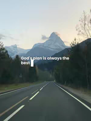 A scenic image of a road leading towards a mountain range under a bright sky. The road is a dark asphalt, with multiple white lines. The text overlay is positioned in the middle-left, written in white.