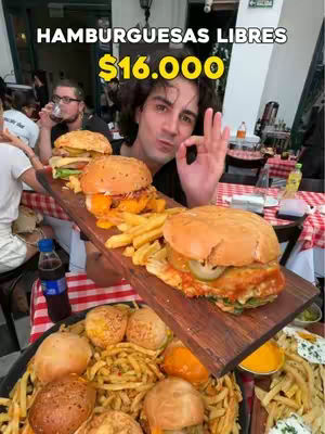 A man holding a tray of burgers and fries, gesturing with an OK sign. Text overlays advertise burgers for a specific price.