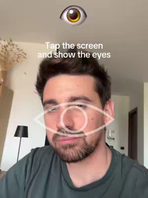 A man with dark hair and a beard looking towards the viewer with an eye graphic over his face, along with a text overlay of an eye at the top.