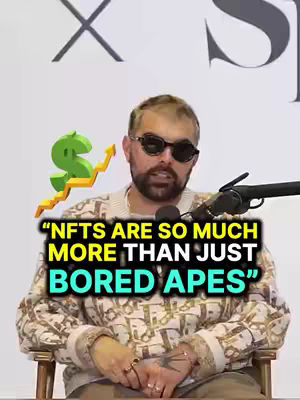 A man wearing sunglasses and a patterned sweater sits in front of a microphone with a dollar sign graphic and text overlay.