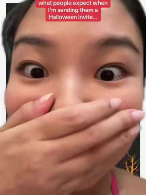A close-up shot of a person's face, covering their mouth with their hand and displaying wide eyes. Above, text in a red box states "what people expect when I'm sending them a Halloween invite..."