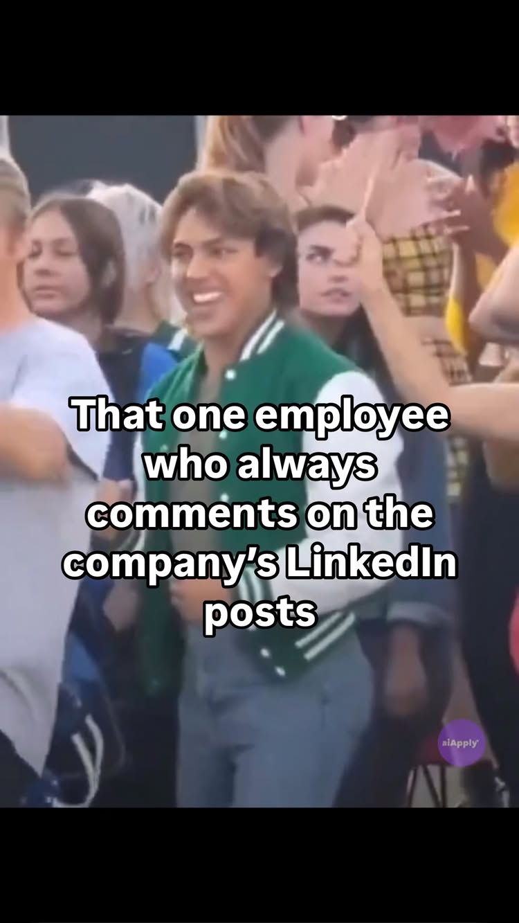 Image shows a man in a green and white letterman jacket surrounded by a crowd, with overlaid text.  The man has short brown hair and is smiling widely. Other people are visible in the blurred background.