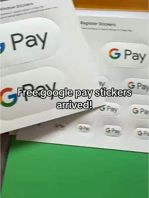 The image displays a collection of Google Pay stickers and a sheet of paper with stickers. On the left side, two stickers are prominently displayed with the "Pay" logo, and the Google logo. In the center, the text overlay reads “Free Google pay stickers arrived!”.