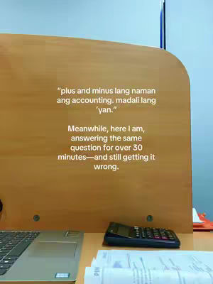 The cover image features a workspace with a wooden desk, a laptop, a calculator, and printed papers. Text overlays are added to the image, containing a quote and a description of the situation, which is likely about accounting studies.