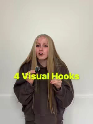 The cover image features a young woman with long blonde hair, wearing a brown hoodie, holding a microphone and speaking. Overlayed text in a yellow font reads '4 Visual Hooks'. The background is a plain off-white wall.