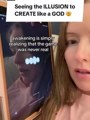 A woman in a pink shirt looks down and right toward a tablet screen. The tablet shows a reflection of the woman, with some text overlaying the mirrored face, and some animated circles. Above the tablet is a white box with text, 'Seeing the ILLUSION to CREATE like a GOD' and a thinking face emoji.