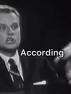 Black and white close-up of a man in a suit speaking, with the word "According" overlaid in white font.