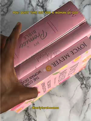 The cover image shows a hand holding three pink books, possibly Bibles and devotionals, with a light-colored, possibly marble, background. The books are stacked at a slight angle, with the titles and author names visible. Overlayed text at the top states 'POV: QUIET TIME SET FOR A WOMAN OF GOD'. The perspective suggests someone is setting up or presenting these items, perhaps for a content creation or informational video.