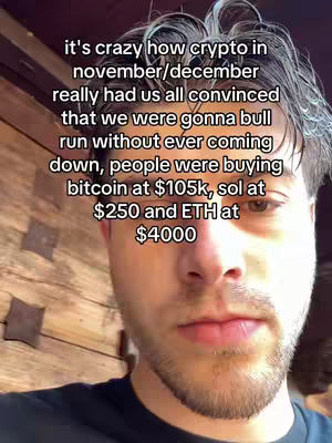 A selfie-style video with the creator's face filling most of the frame. The background is a wooden panel. The creator has short, dark hair and a light beard, looking slightly down with a neutral expression. Overlaid text appears on top of the creator's face.