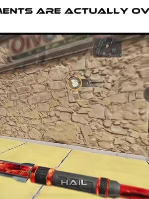 The image shows the view from within the game Call of Duty (COD). In the foreground is the handle of a weapon, with a red and black color scheme and the word 'HAIL'. In the background is the game environment, with a stone wall.