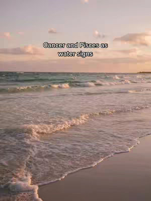 The cover image shows a tranquil beach scene at sunset. The ocean stretches out to the horizon, with gentle waves lapping the shore. The sky is filled with soft pink and orange hues, suggesting either sunrise or sunset. A text overlay in the center reads, 'Cancer and Pisces as water signs'.