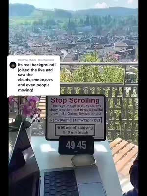 An outdoor scene of a desk setup for studying, with a laptop and a sign that says "Stop Scrolling". In the background there is a view of a town and some trees. The cover image has a calming and motivating vibe.