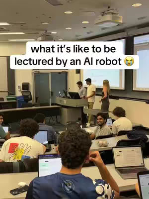 The image shows a classroom setting with students, presumably in a college or university. The focus is on the students and the classroom, with a hook text overlaid. The lighting appears to be from overhead fluorescent lights.