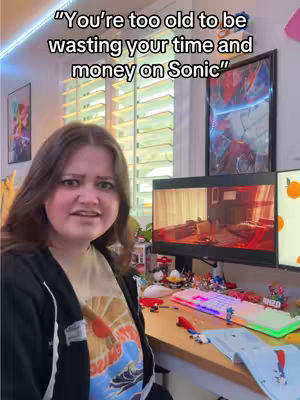 A young woman stands in front of a messy desk, in a room lit with led lights and multiple computer monitors. The hook text is overlaid at the top of the image.