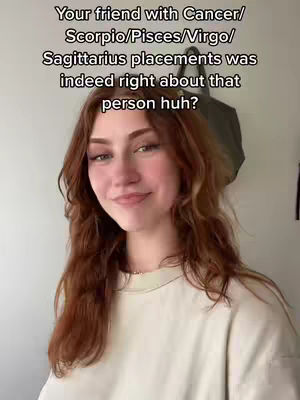 A young woman with auburn hair smiles gently at the camera, framed from the chest up. She wears a light-colored, long-sleeved shirt. Text in white font is stacked above her head.