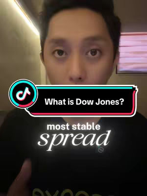 A man is centered in the frame, looking directly at the camera. Overlaid on the image is a TikTok interface element featuring the TikTok logo. A text overlay reads, in a stylized font, "What is Dow Jones?". Below, in white-colored text, is "most stable spread". The background is blurred, suggesting an indoor setting with lighting.