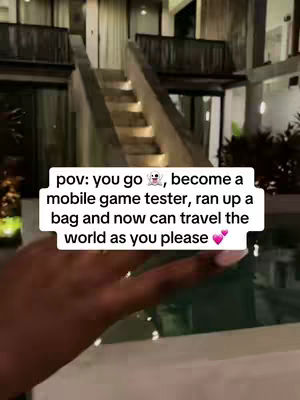 A hand holding a phone in front of an exterior scene with a staircase. The scene is in a tropical environment. Text is overlayed on the image.