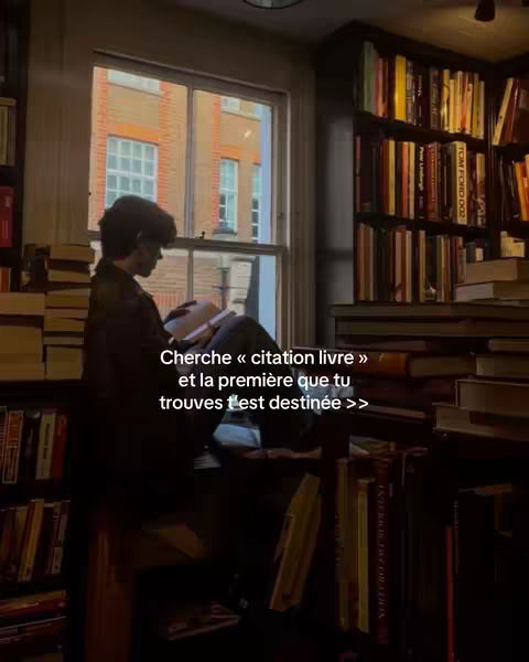 A cozy scene in a library with natural light from a window. A person is sitting on the windowsill engrossed in a book, surrounded by stacks of books and bookshelves filled with volumes.