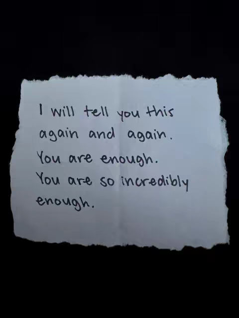A piece of torn paper with handwritten text against a black background. The paper is slightly crumpled with uneven edges. The text is in black ink, and the overall composition is simple and direct, focusing on the message.